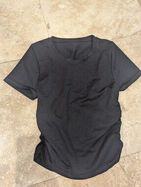 Cute and versatile black fitted short-sleeve top by OQQ. Made from a stretchy,